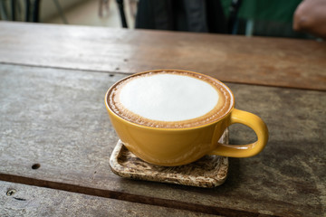 Hot latte coffee and espresso coffee in cup on wood table