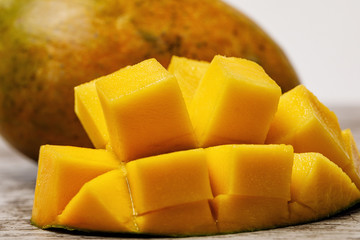 fresh juicy yellow Thai chopped mango on the table 