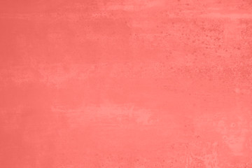 Fototapeta premium Living Coral trendy color of the Year 2019. Grunge wall toned blurred background. Abstract old texture with copy space
