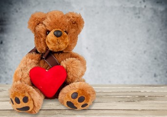 Cute Teddy bears on wooden table