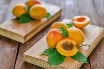 Ripe apricots beautifully lying on natural boards.