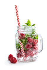 Homemade raspberry and mint drink in glass jar isolated on white