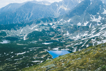 Polish Tatras and blue deep lakes on the hillsides