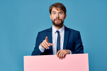 businessman holding blank sign