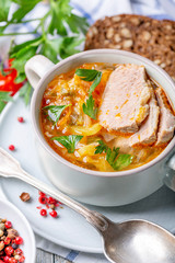 Traditional soup with fresh cabbage and meat.