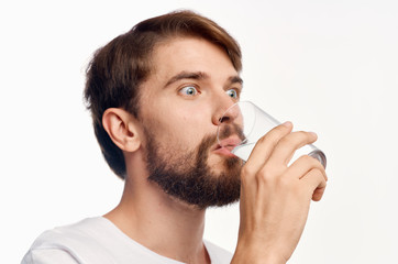 man shaving beard off with shaver