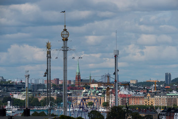 Naklejka premium View over the island Djurgården, old town and district Södermalm with ferries and commuting boats in Stockholm.
