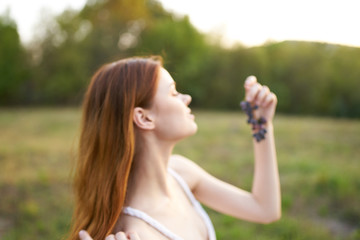 young woman with a bottle of water in the park
