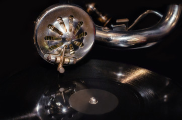 vinyl record and fragment of vintage gramophone close up