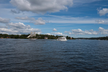 View over the island Djurgården, old town and district Södermalm with ferries and commuting boats in Stockholm