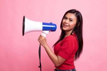 Beautiful young Asian woman announce with megaphone.