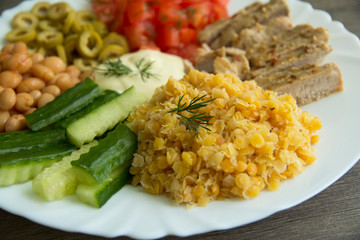 Lentils, chicken, olives,white beans, cucumbers, tomatoes and sauce