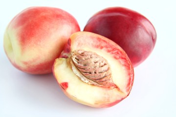 half of peach isolated on white background