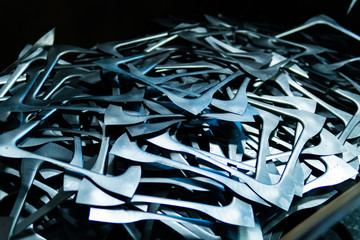 The steel waste,metal pile,stainless steel rubbish,stacked together,prepare for recycle and reused.