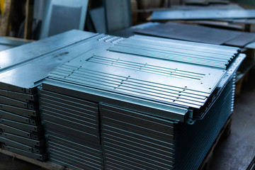 Steel sheets deposited in stacks in packs at the warehouse of metal products. Weathered metals...