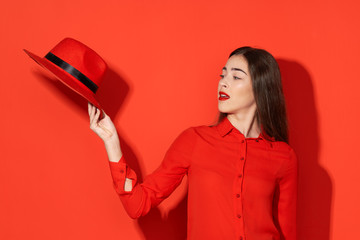 Naklejka premium portrait of young woman in red dress