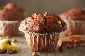Chocolate chip muffin with chocolate bar. White and dark chocolate.