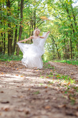 adorable child in long white wedding dress