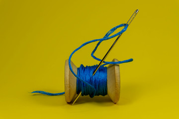 Spool of thread with needle