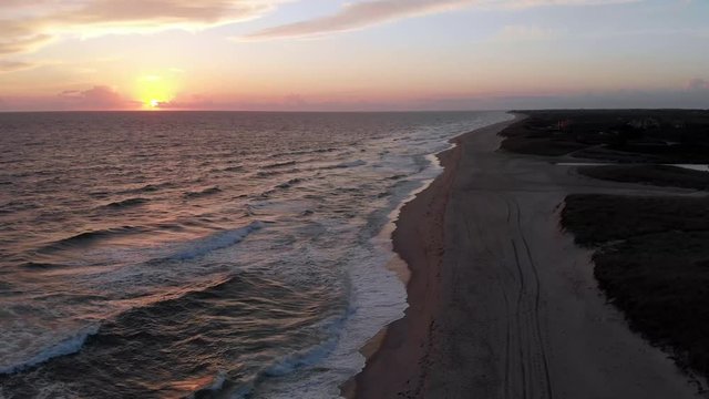 Aerial 4k Footage of Sunset at Miacomet beach, Nantucket, famous tourist attraction and Landmark of Nantucket Island.