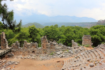 Fototapeta na wymiar Old amphitheater. Ruins of the ancient town at Phaselis, Turkey.