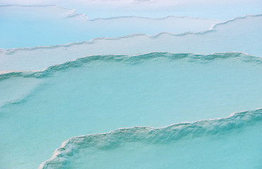 Blue travertine pools and terraces in Pamukkale, Denizli, Turkey. Background and texture from Cotton castle