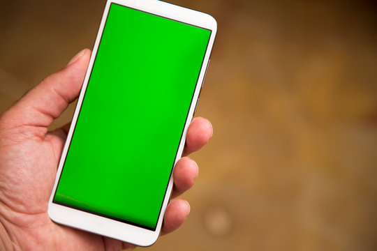 Left handed man hand with smart phone