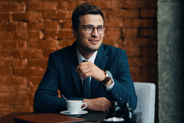 young businessman drinking coffee