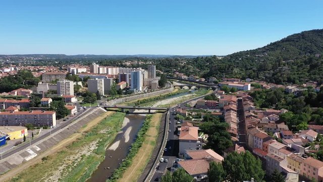 Al&egrave;s river le Gardon, buildings bridge residential urban area France aerial shot 