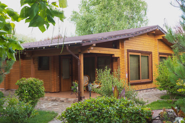 Country cottages with log and timber in the green area. cozy eco-friendly houses made of natural wood, bungalows for families