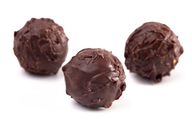 Dark Chocolate Truffles Filled with Caramel on a White Backgroun