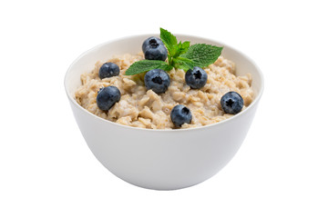 Oatmeal porridge with blueberries and mint isolated