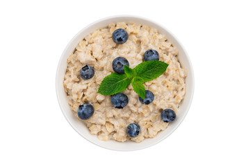Oatmeal porridge with blueberries and mint top view isolated