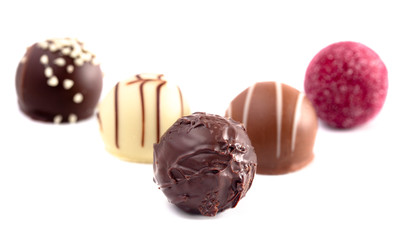 Variety of Chocolate Truffles Isolated on a White Background