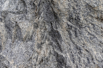 Dark gray stone surface with black stripes. Grunge stone surface. Texture of natural stone.