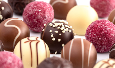 Variety of Chocolate Truffles Isolated on a White Background