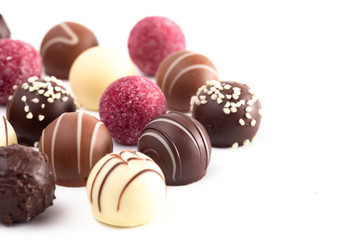 Variety of Chocolate Truffles Isolated on a White Background