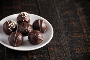 Chocolate Truffles on a Rustic Wooden Table