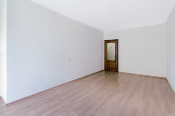 Empty light room in cool pastel colors with wooden floor and glass door