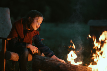 woman with fire in forest