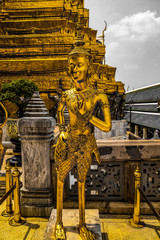 Obraz premium Beautiful close up color black white and gold Wat Phra Kaew or Temple of Emerald Buddha, Guardian statues pagoda and Grand palace located within the grounds of the Grand Palace in Bangkok