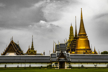 Naklejka premium Beautiful close up color black white and gold Wat Phra Kaew or Temple of Emerald Buddha, Guardian statues pagoda and Grand palace located within the grounds of the Grand Palace in Bangkok