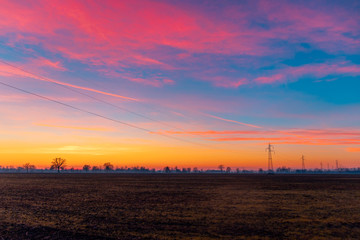 Fototapeta premium Colorful sunset over field