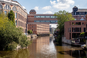 View from the river Weisse Elster in Leipzig,Germany. It is a popular place to live in wonderful architecture in old Factory buildings . This is a beautiful place to live and for water sports.
