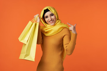 young woman with shopping bags