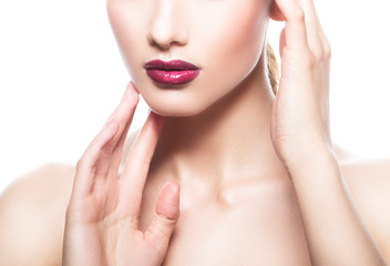 Lips, hands, shoulders of young model woman. Glossy red lipstick makeup, clean healthy skin