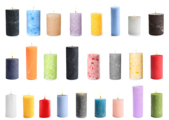 Five color wax candles on white background