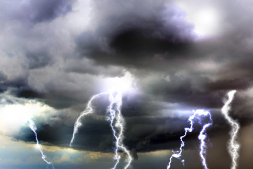 Sky with heavy rainy clouds and lightnings. Thunderstorm