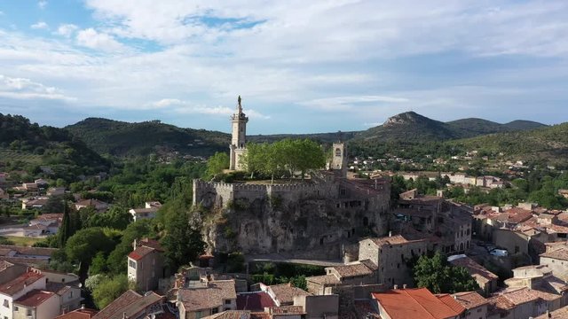 Saint Ambroix aerial view of Dugas Rock medieval city Gard France castle ruins