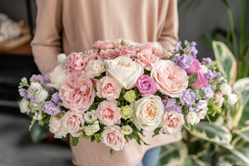 Beautiful bouquet of mixed flowers in woman hand. Floral shop concept . Handsome fresh bouquet. Flowers delivery